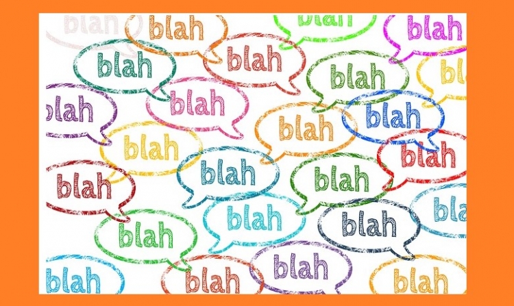 text balloons with blah blah blah written in it in different colors.